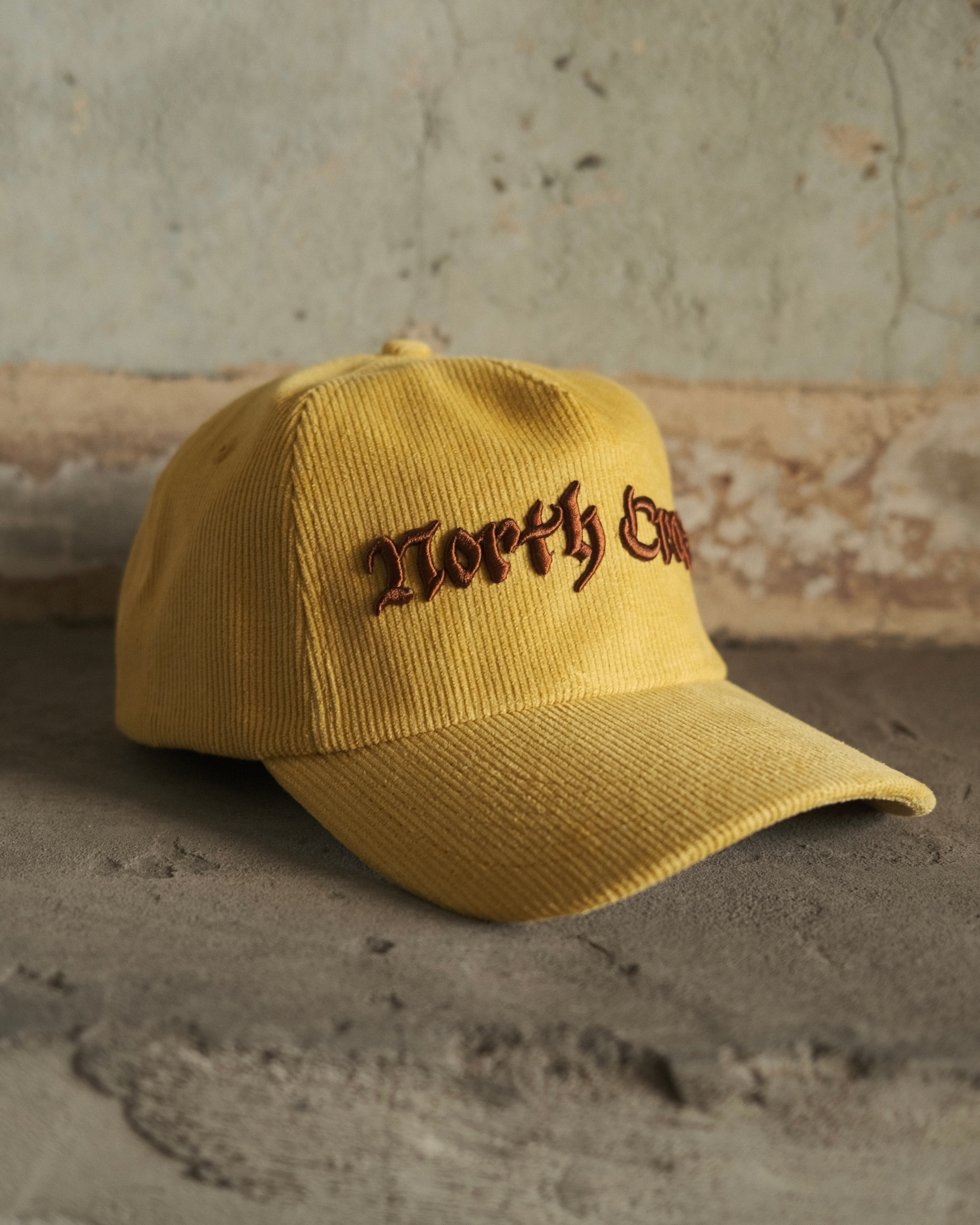North Cross yellow cord cap