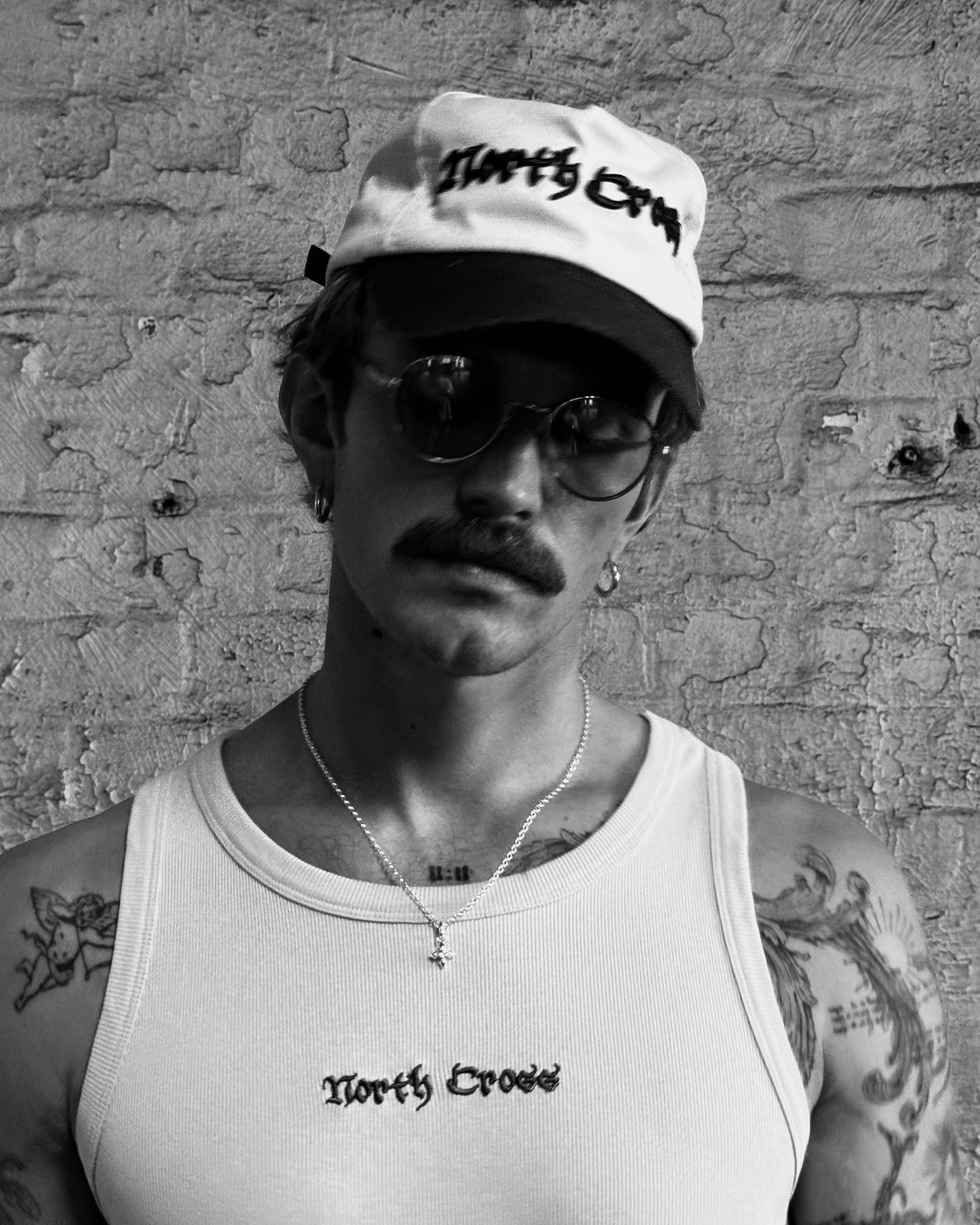 Josef Michael wearing The North Cross diamond cross on 18" chain