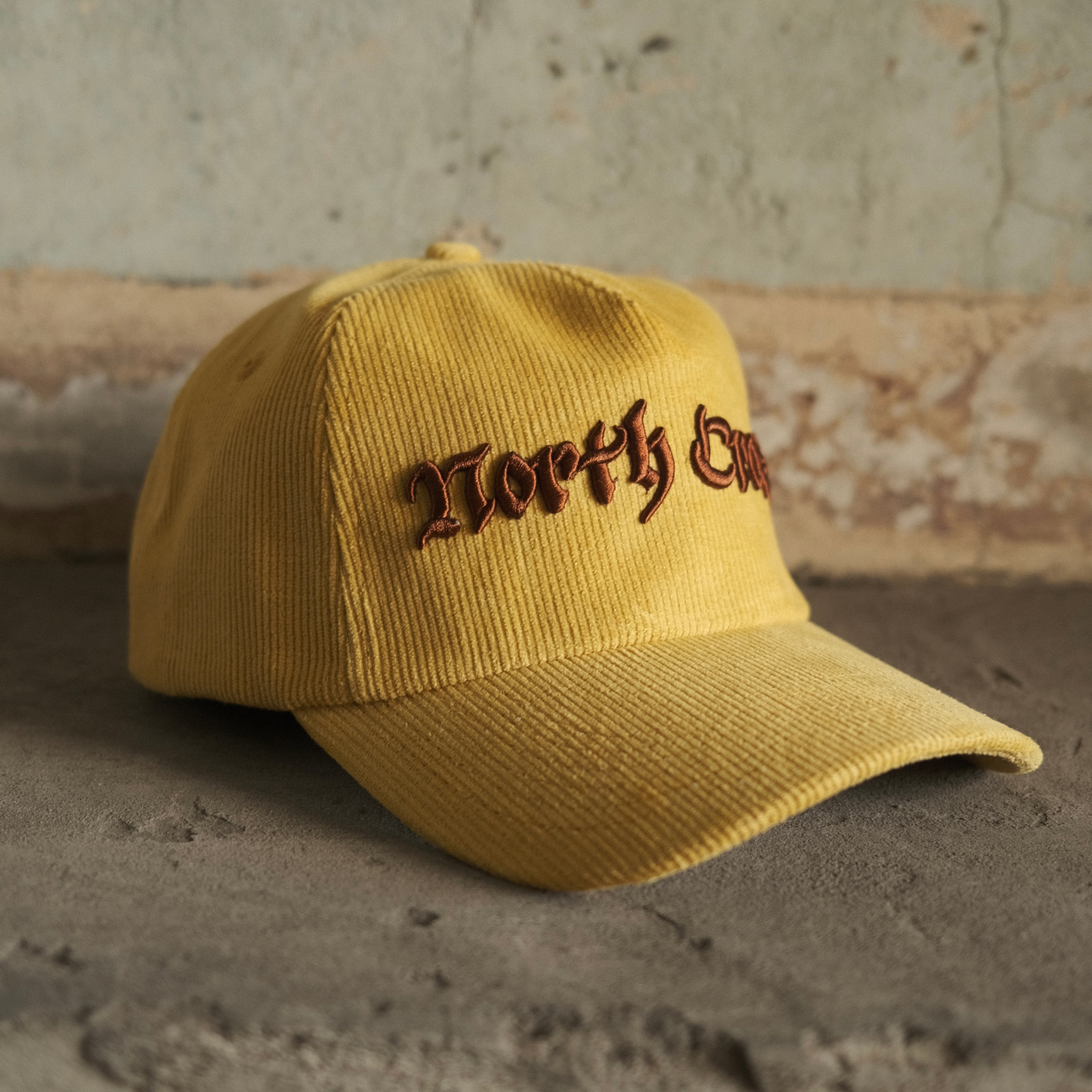 North Cross yellow cord cap