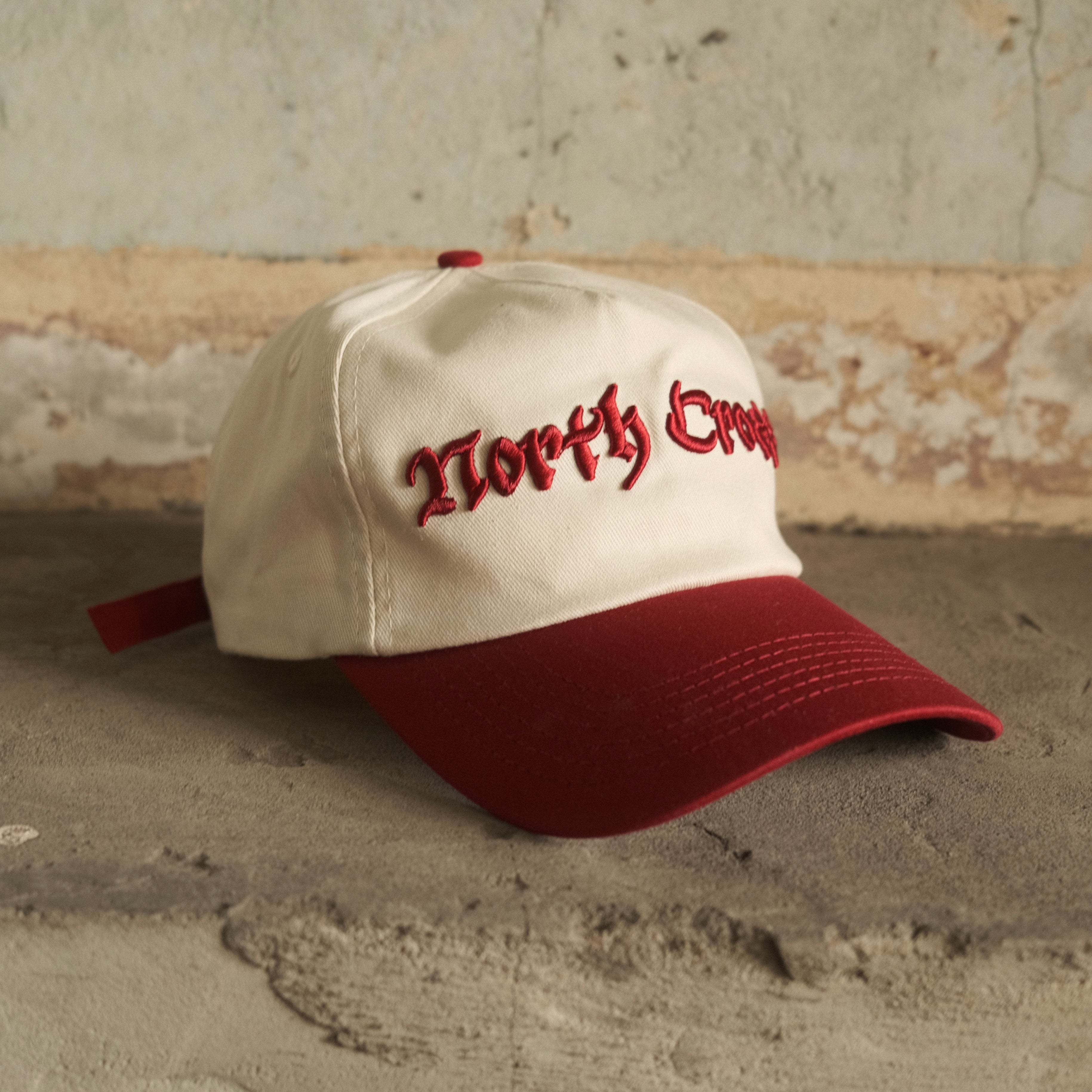 Red North Cross baseball cap with clasp back