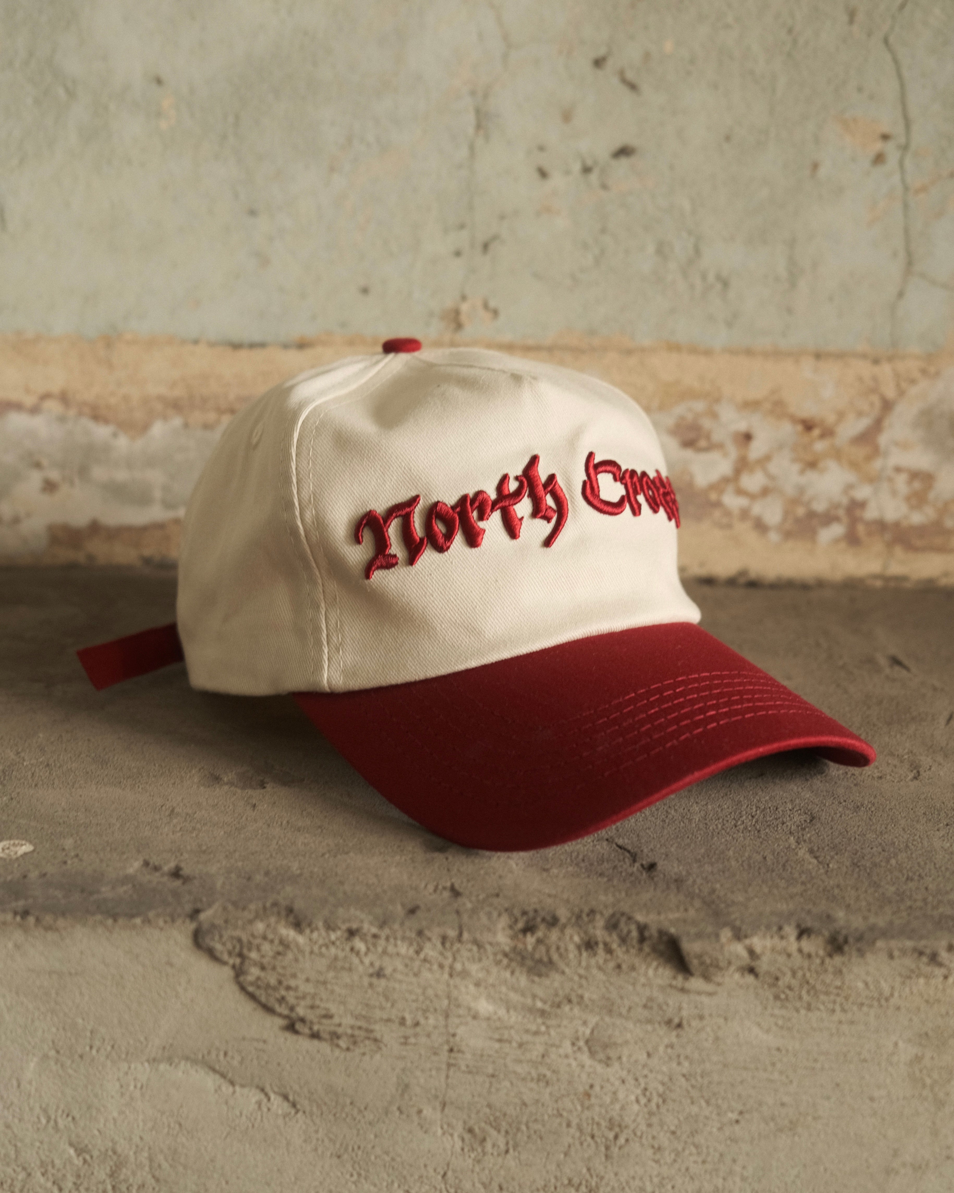 Red North Cross baseball cap with clasp back